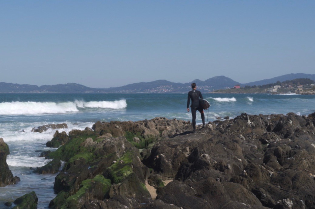 Picture of a surfer on Patos beach in Galicia