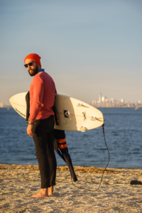 Image of a surfer look man with a surfboard