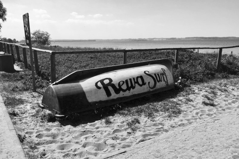 an old boat on the beach in Rewa, Poland